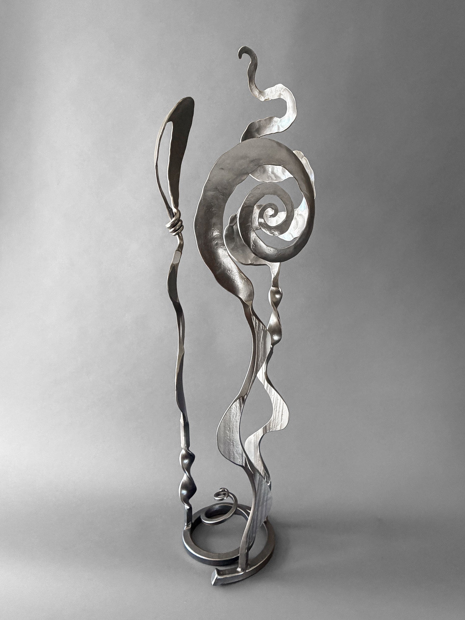 Contemporary metallic steel Baby Bloom sculpture featuring Christopher Thomson's signature Meander, Balloon, and Rose forms in a freestanding abstract composition.