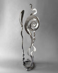 Contemporary metallic steel Baby Bloom sculpture featuring Christopher Thomson's signature Meander, Balloon, and Rose forms in a freestanding abstract composition.