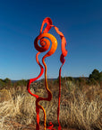 Orange and red baby bloom steel sculpture.