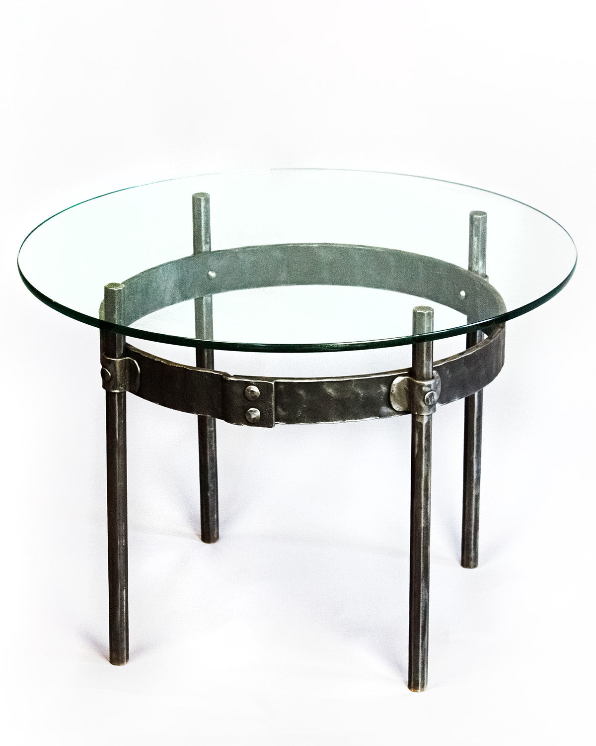 Ring Wrought Iron Cocktail Table with a round glass top.