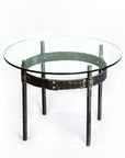 Ring Wrought Iron Cocktail Table with a round glass top.