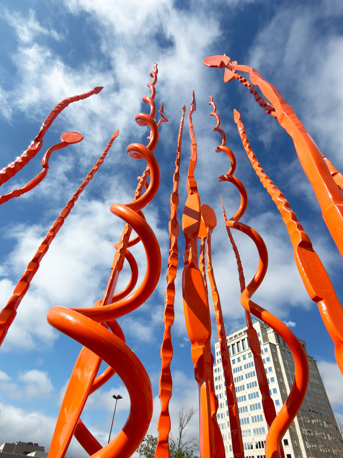Tapered steel forgings of Spiral Pajos #5 spiraling upward around an Archimedean base