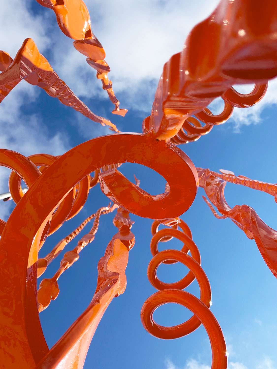Upward looking close-up of the forged steel spiral tendrils and looping forms on Spiral Pajos #5