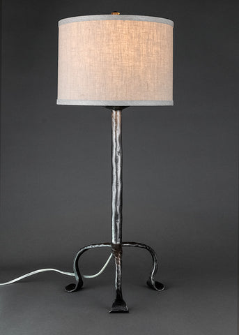 Simply Santa Fe wrought iron lamp shown with a linen drum shade.