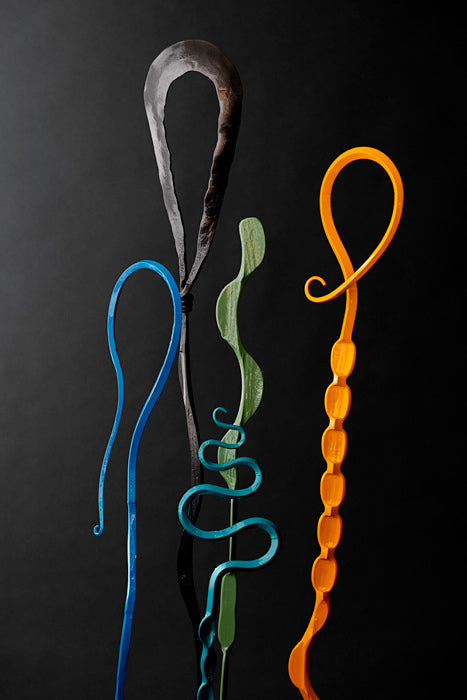 Hand forged steel sculptures, Single Blooms, in the colors Sky Blue, Metallic, Sage, Orange, and Turquoise. Hand forged by Christopher Thomson Ironworks.