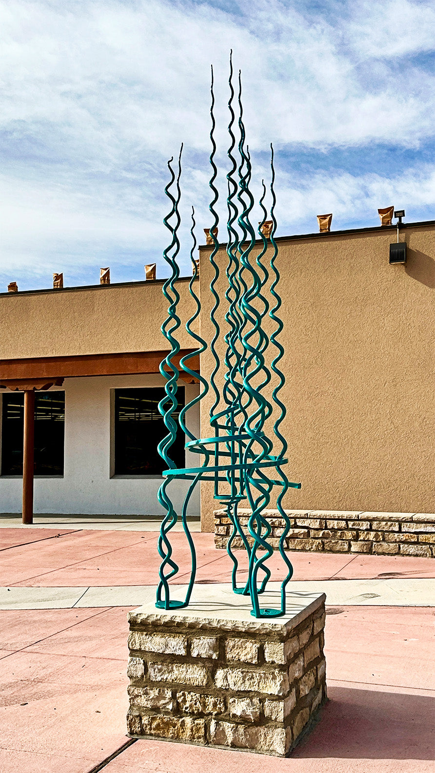 Turquoise steel public sculpture by Christopher Thomson Ironworks. 