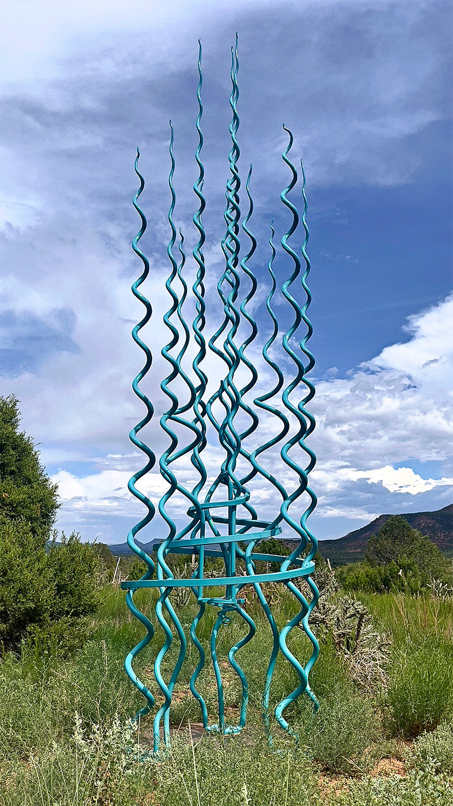 Large turquoise abstract sculpture.