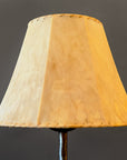 Raw sheepskin hide lamp shade. Showing the top of a wrought iron lamp