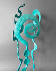 Hand forged turquoise sculpture detail showing the spiral bloom design.