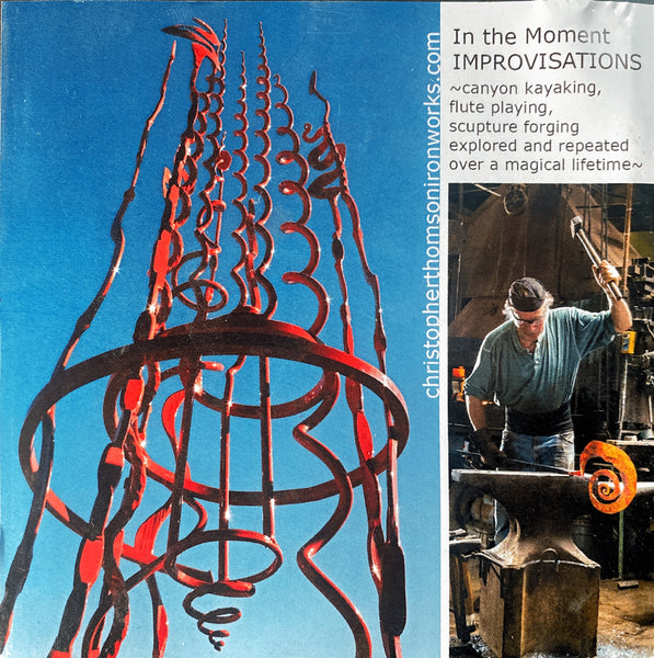 Album artwork with a red abstract sculpture and Christopher Thomson working in his blacksmith shop. Text reads "In the Moment Improvisations" - canyon kayaking, flute playing, sculpture forging, explored and repeated over a magical lifetime."