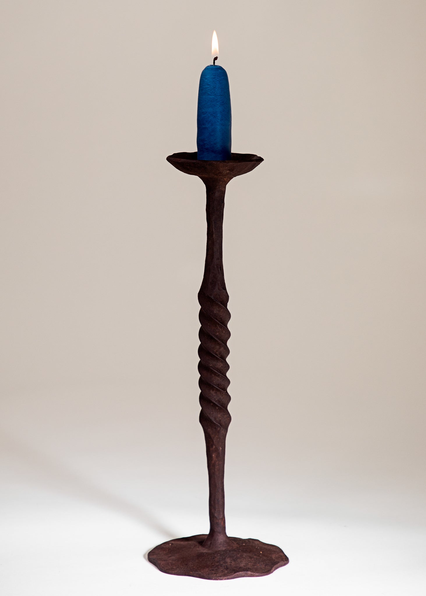 Single Spiral rustic hand forged Candlestick holder with a wide base. 