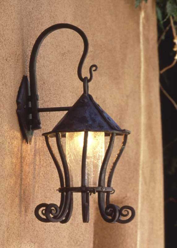 Wrought iron Hanging Wall Lantern with scrolls.