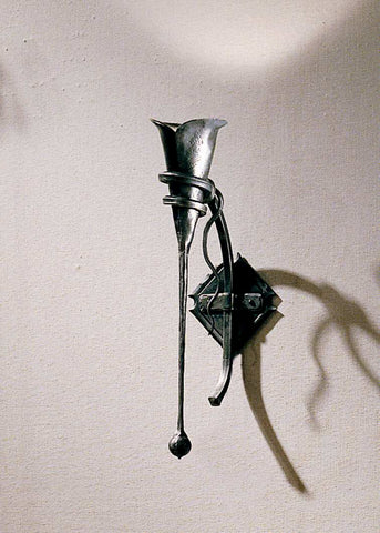 Large Calla Wall Sconce w/ Tendril with a hammered calla lily that supports the candle and bulb.