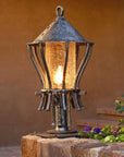 Hand forged outdoor Wrought Iron Post Lantern installed along a walkway for pathway lighting. Made by blacksmith, Christopher Thomson in Santa Fe, New Mexico.