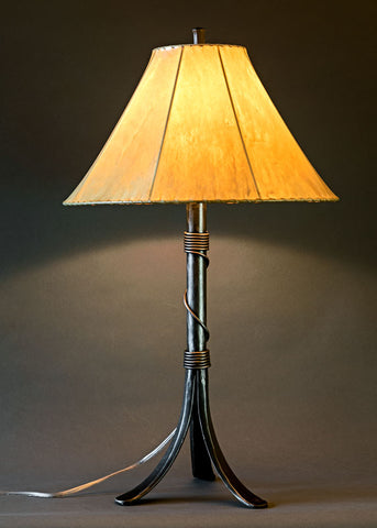 Twisted Valley Iron bedside lamp with a sheepskin shade.