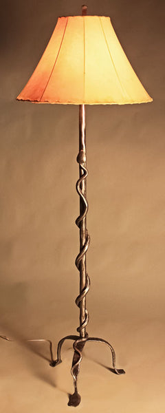 Hand forged western iron floor lamp with a rattlesnake design by blacksmith Christopher Thompson.