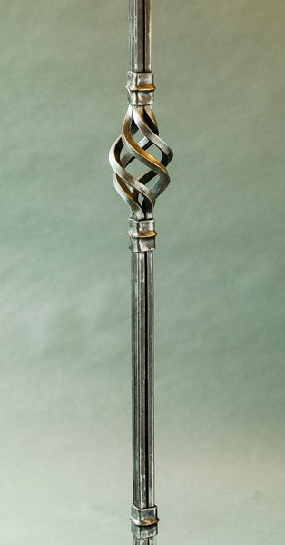 Hand forged detail shot showing decorative forgings on a coat hat stand stem.