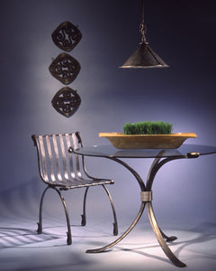 Dining area showing a forged iron Dining Table.