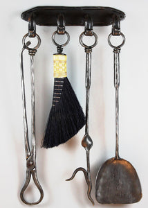 Forged steel, wall hanging "Four Tool Fireplace Wall Set" with a shovel, poker, broom, and tongs. 