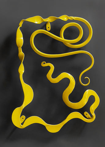 Yellow abstract metal wall sculpture.