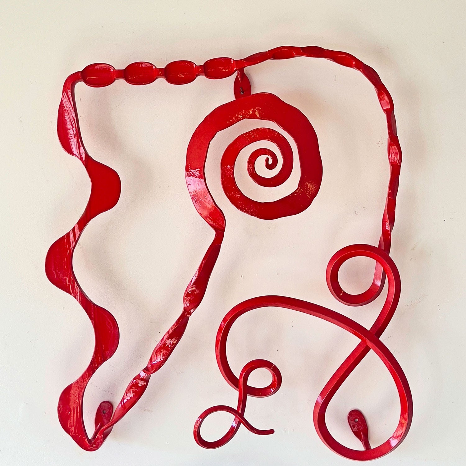 Red metal wall sculpture, Musing #17, hand forged by Christopher Thomson Ironworks