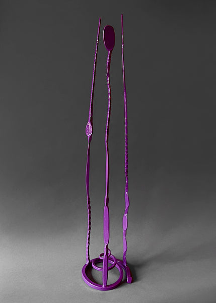 Purple colored forged steel "Baby Pajos" free standing sculpture with three long tendrils pointing up.