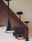 Three small sized hand forged "Ceiling Pendants" with a Rustic Black finish.